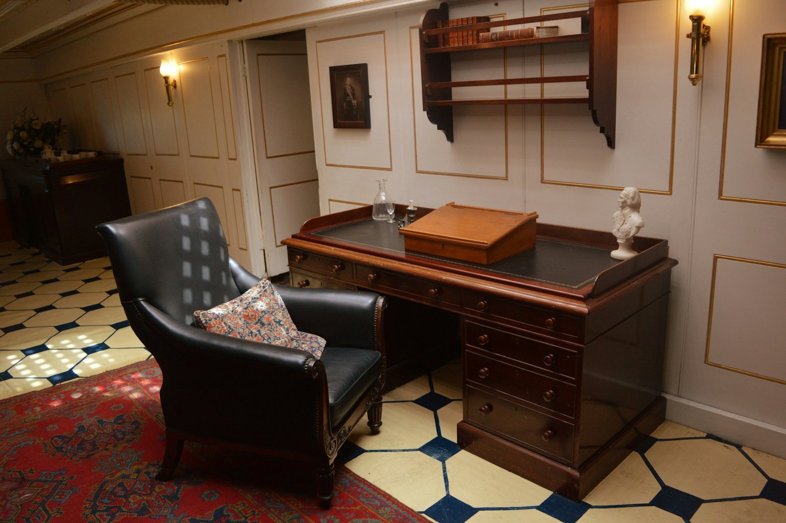 Finished bespoke home office with fitted desk and shelving