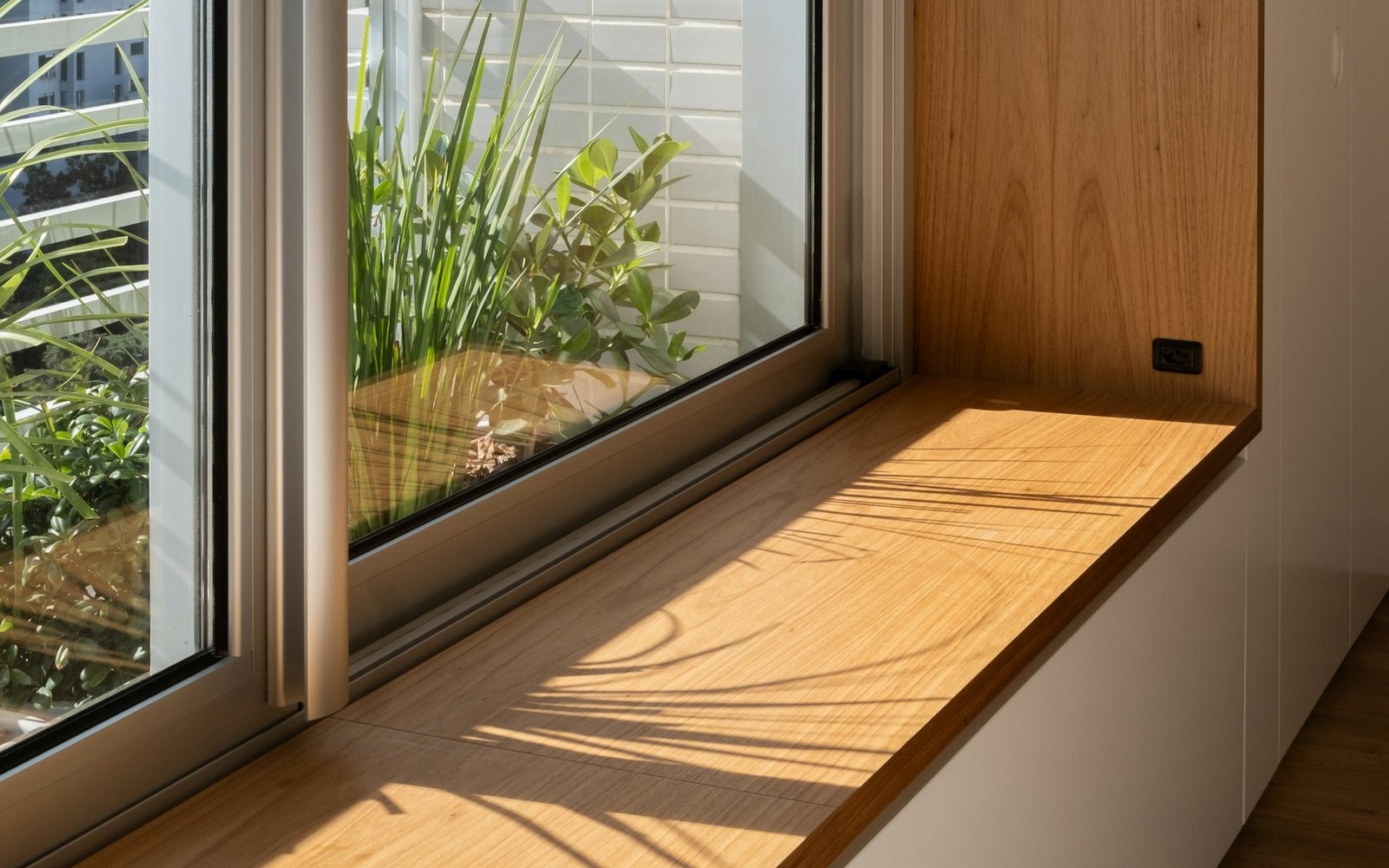 Built-in window seat with fitted storage beneath
